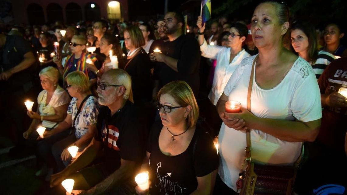 Residents carry out a vigil to honor the memory of the Puerto Ricans that died in the mass shooting at a nightclub in Orlando, Fla., at the Hato Rey LGBTT Community Center in San Juan, Puerto Rico, Tuesday, June 14, 2016. Dozens of people died at the 'Pulse' gay nightclub in Orlando, making it the deadliest mass shooting in modern U.S. history.