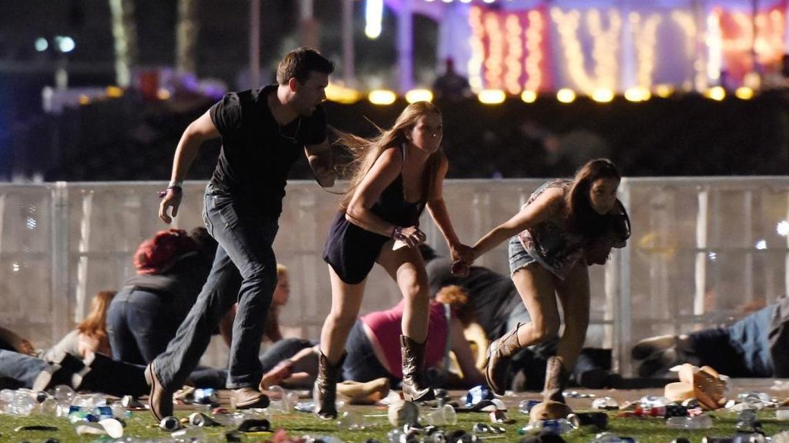 People run from the Route 91 Harvest country music festival after during Sunday’s mass shooting in Las Vegas.