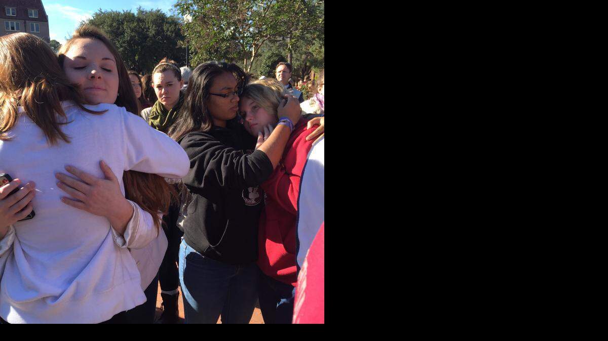 
Students comfort each other Thursday morning after the shooting at FSU’s Strozier Libarary. 
