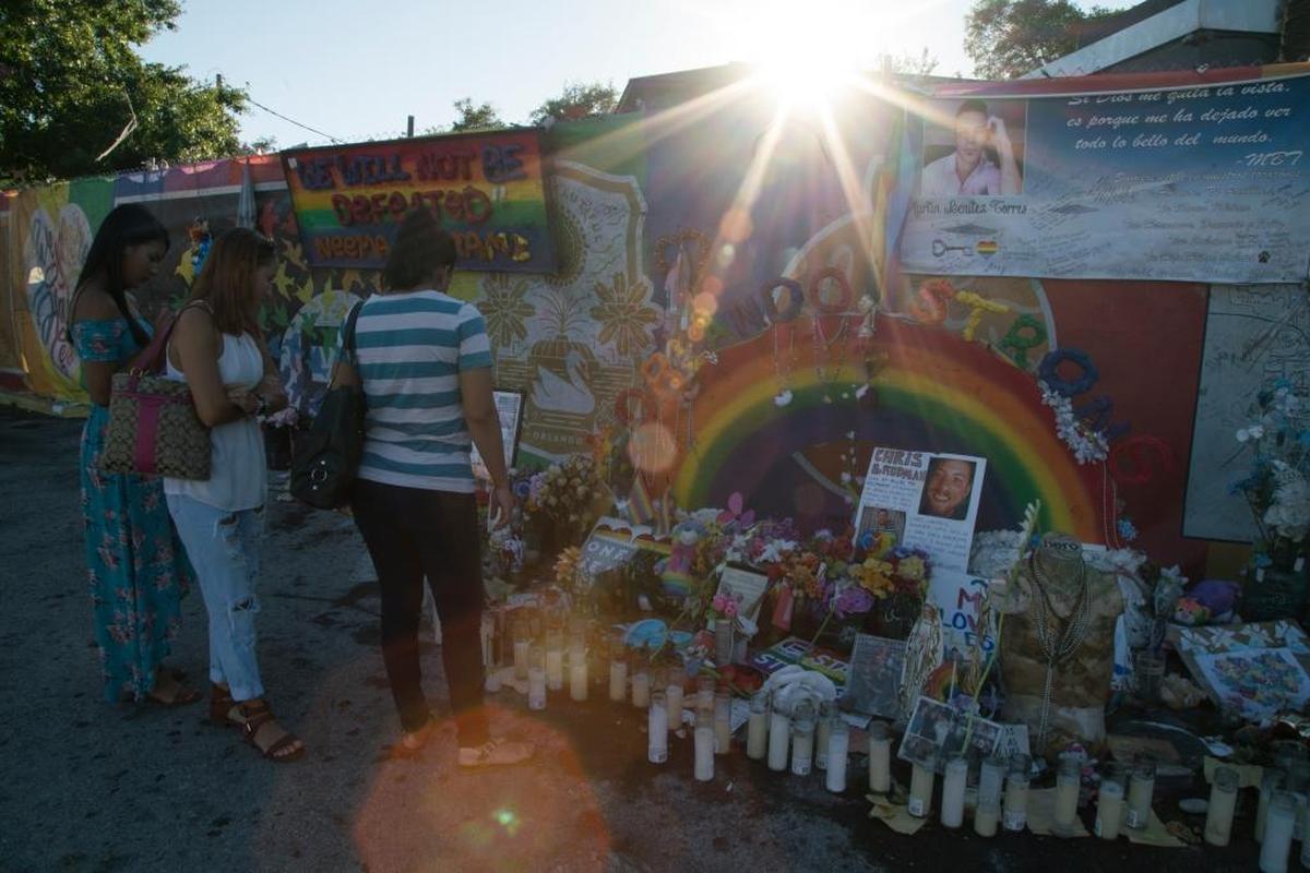 A year following the Pulse night club tragedy, the property remains covered with messages, candles, artwork, photos and memorabilia honoring the victims and survivors.