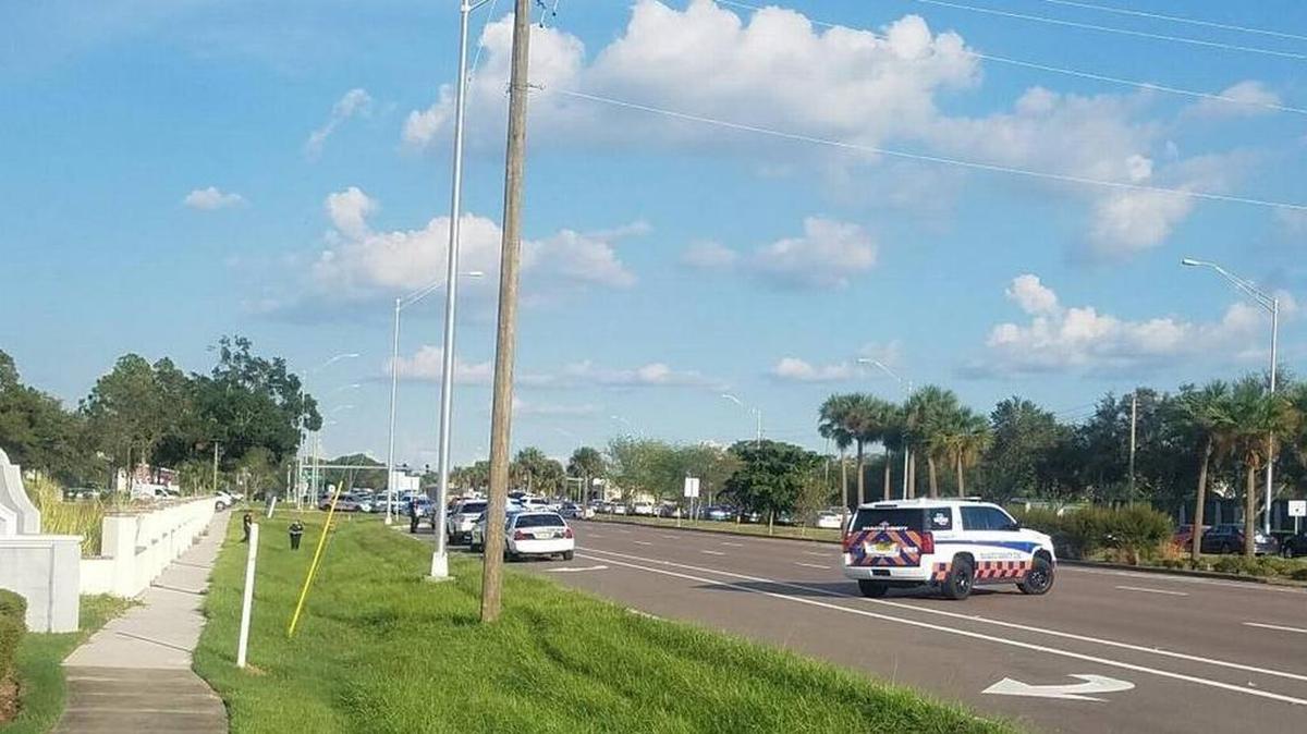 Bradenton police officers clear the scene on State Road 64 after a machete-waving man surrendered to them Monday afternoon.