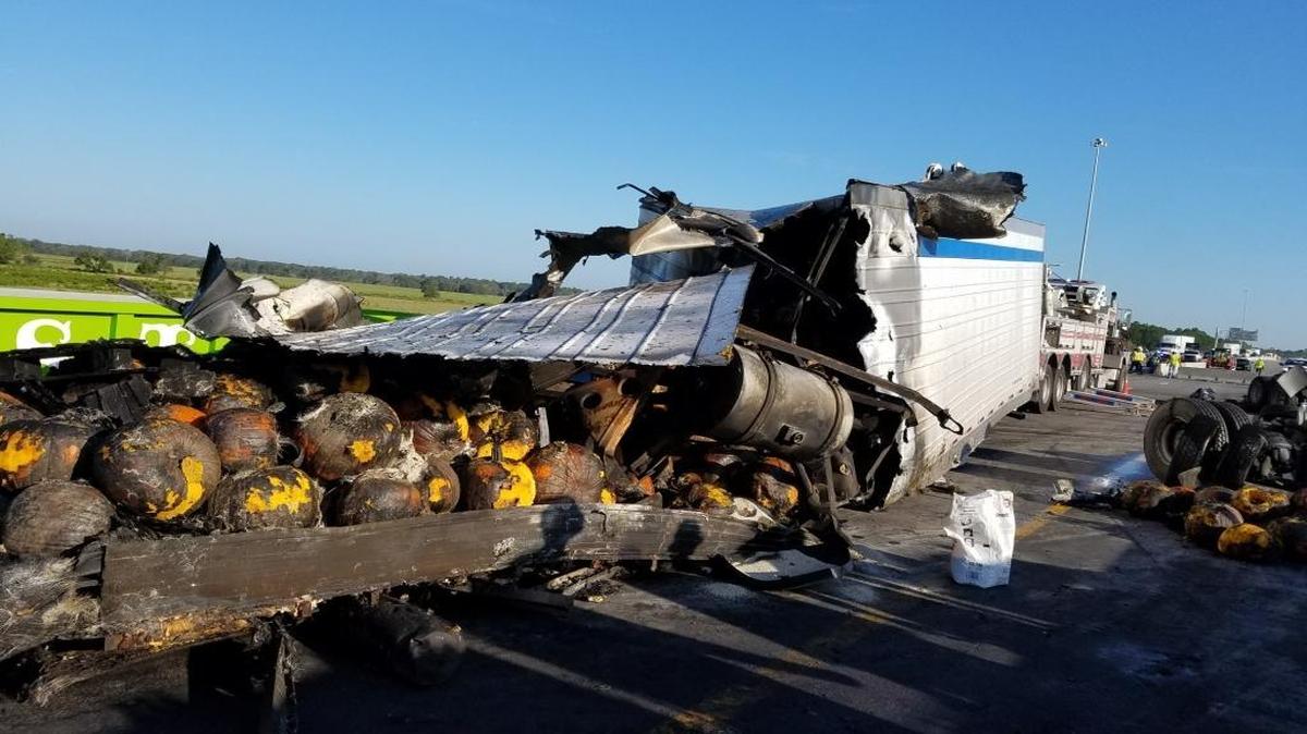 The semi truck that crashed and went up in flames early Friday morning was carrying a load of pumpkins that were burned and spilled into the roadway.