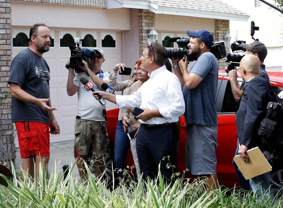 Eric Paddock, left, brother of Las Vegas gunman Stephen Paddock, speaks to the media outside his home on Monday in Orlando. “We are completely dumbfounded,” he said.
