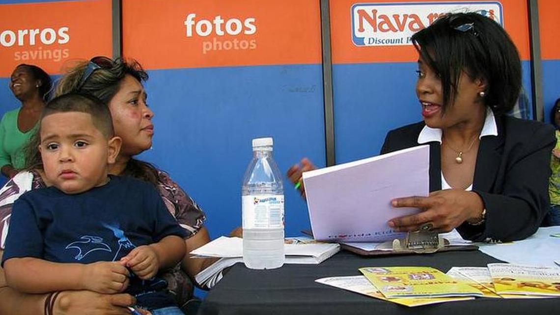 Reina Lobo holds her grandson, Julio, in this 2014 photo. The family met with Nadine Gousse, of the Human Services Coalition, a group working to enroll low-income Hispanic children in Florida KidCare.
