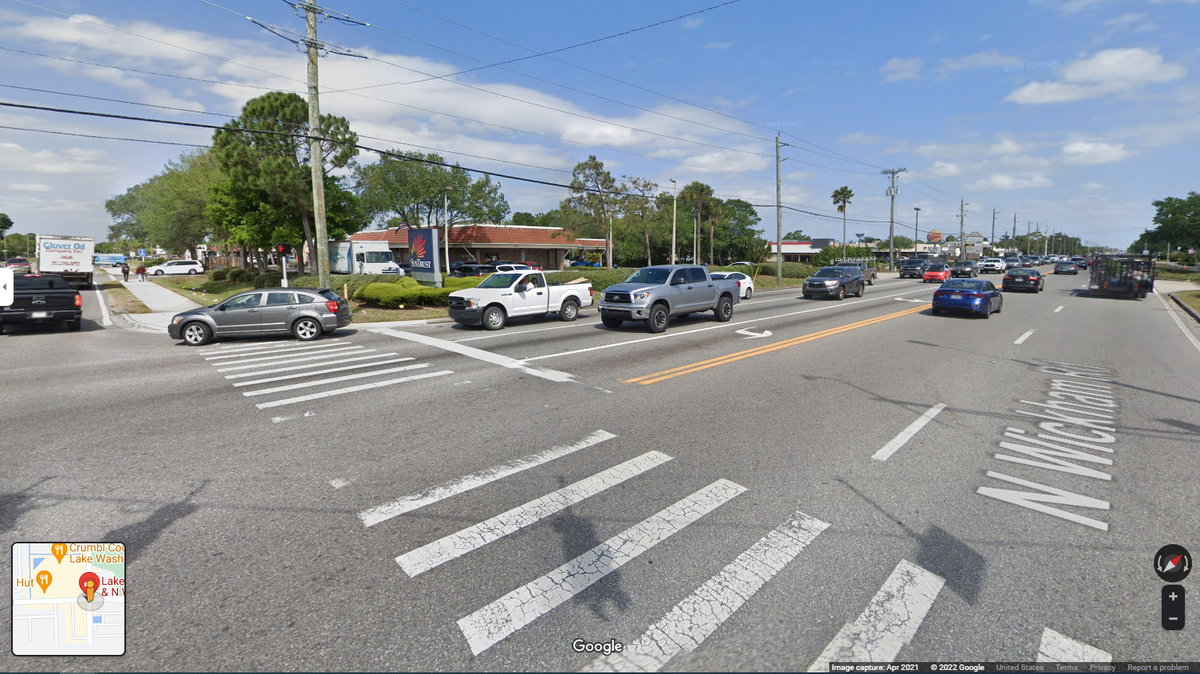 A woman in a motorized wheelchair and her dog were crossing an intersection in Melbourne, Florida when an SUV struck and killed them, police say. 