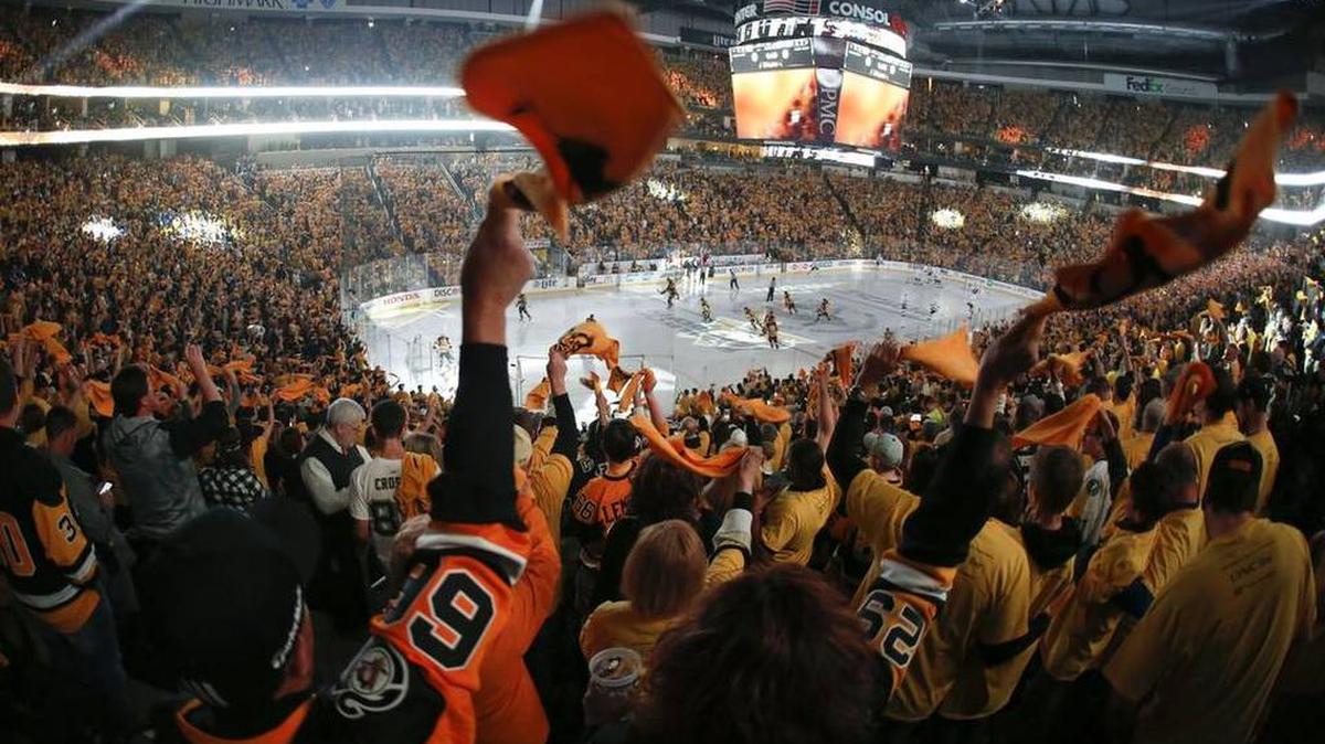 Pittsburgh Penguins fans twirl towels and cheer as the team is introduced at the Consol Energy Center before Game 1 between the Penguins and the Tampa Bay Lightning in the NHL hockey Stanley Cup Eastern Conference finals Friday in Pittsburgh.