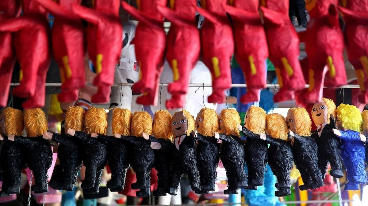 Piñatas that resemble President Donald Trump are displayed in a store at Mercado Hidalgo on Jan. 27 in Tijuana, Mexico. Trump announced a proposal to impose a 20 percent tax on all imported goods from Mexico to pay for the border wall between the United States and Mexico.