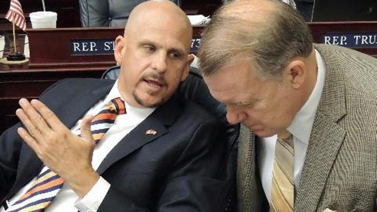 Former state Rep. Ritch Workman, R-Melbourne, speaks with former Rep. Doug Broxson, R-Midway, during a debate on the House floor in 2013. Gov. Rick Scott has named Workman to the Public Service Commission.