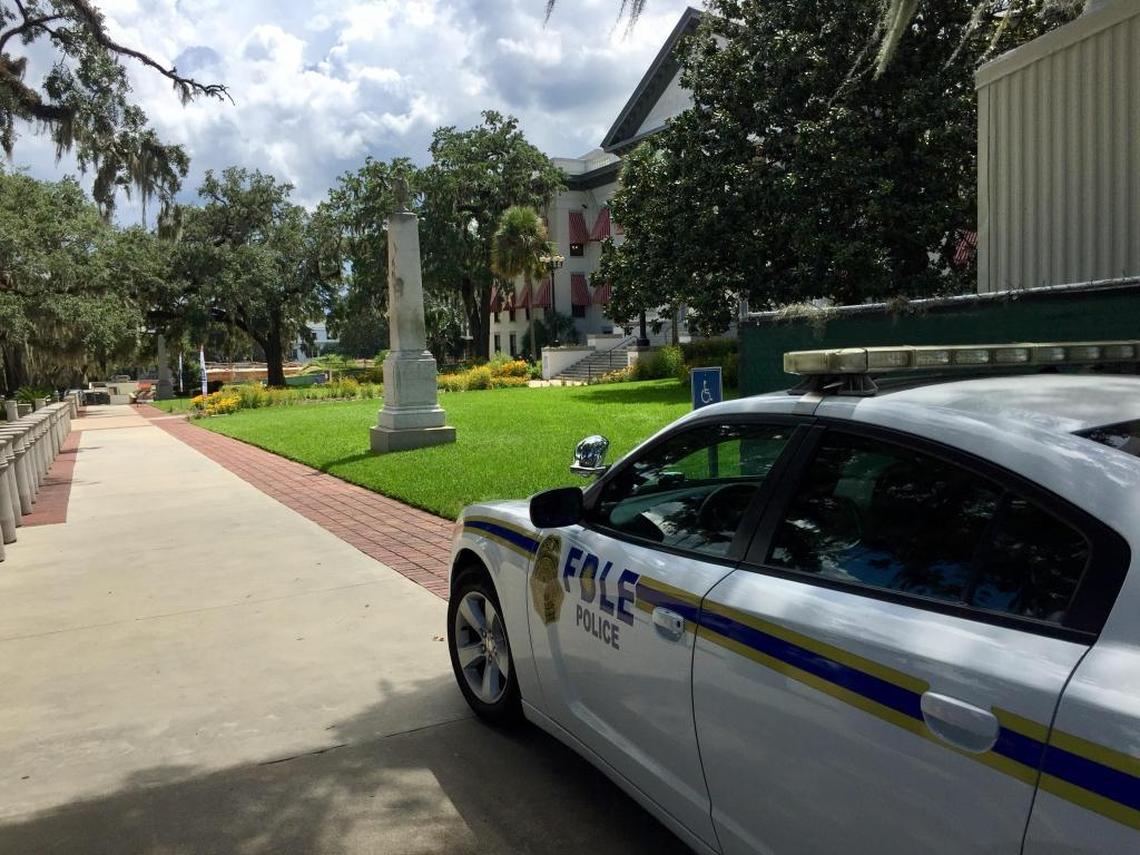 An unmanned patrol car from the Florida Department of Law Enforcement sits parked near a monument honoring slain Confederate soldiers at the state Capitol Complex in Tallahassee on Wednesday, Aug. 16, 2017. Some politicians want the monument removed in the wake of the violent white supremacist rallies in Charlottesville, Va., last weekend.