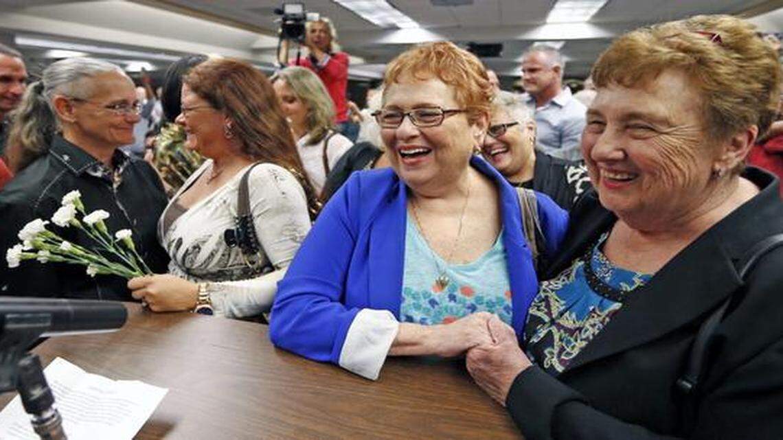 
Roberta Marpet and Arlene Louis of Margate, smile during a mass wedding at the Broward County Courthouse in Fort Lauderdale, Fla., Jan. 6, 2015. Gay couples in the Florida Keys, Broward and Palm Beach counties were getting married at courthouses after the stroke of midnight marked the start of Tuesday morning and the end of Florida’s prohibition on same-sex marriage.
