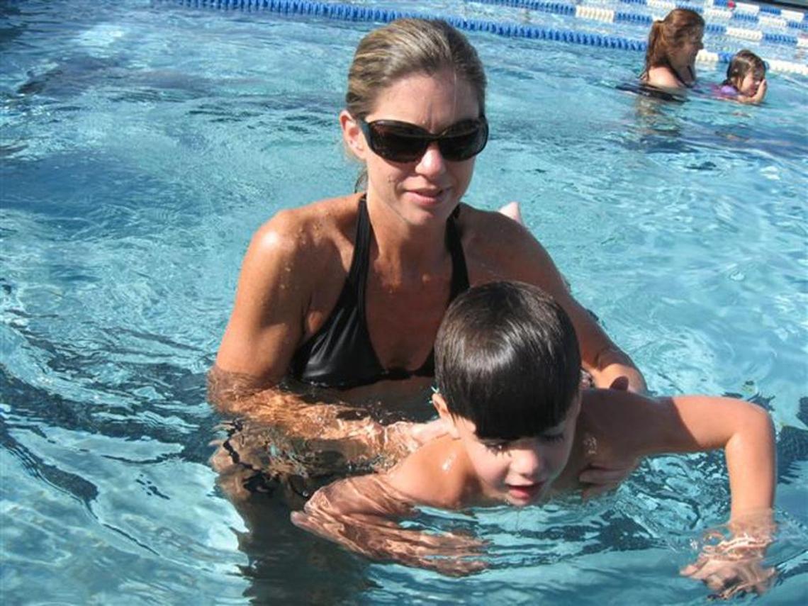 Whitney Chonillo of Cooper City helped son Michael, then 4, during a swim lesson class in 2008.