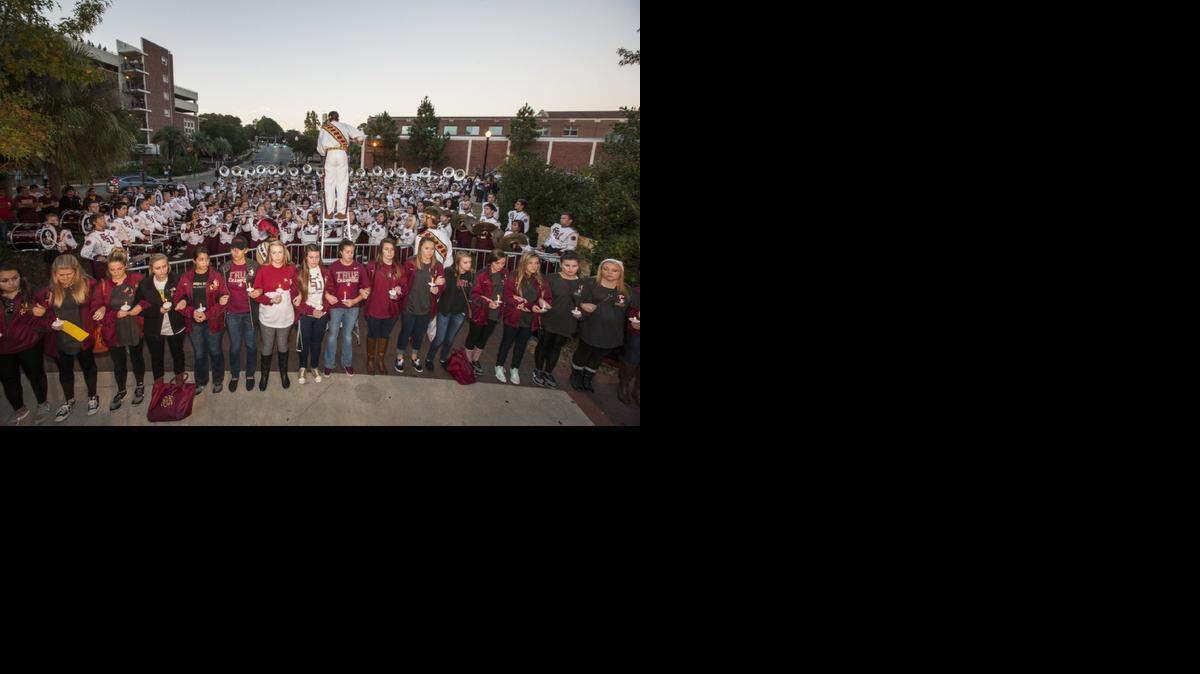 
The Florida State University Marching Chiefs play during the Gathering of Unity candlelight vigil on campus after the shooting of three FSU students earlier in the day on November 20, 2014 in Tallahassee.
