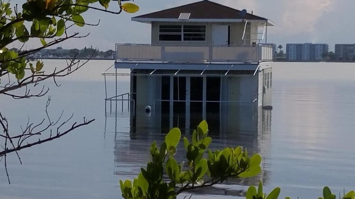 On Monday Aug. 22, Fane Lozman was notified that his floating home was sinking. This photo shows the house that day at low tide. At high tide, he says the water was almost up to the top of the first floor door.
