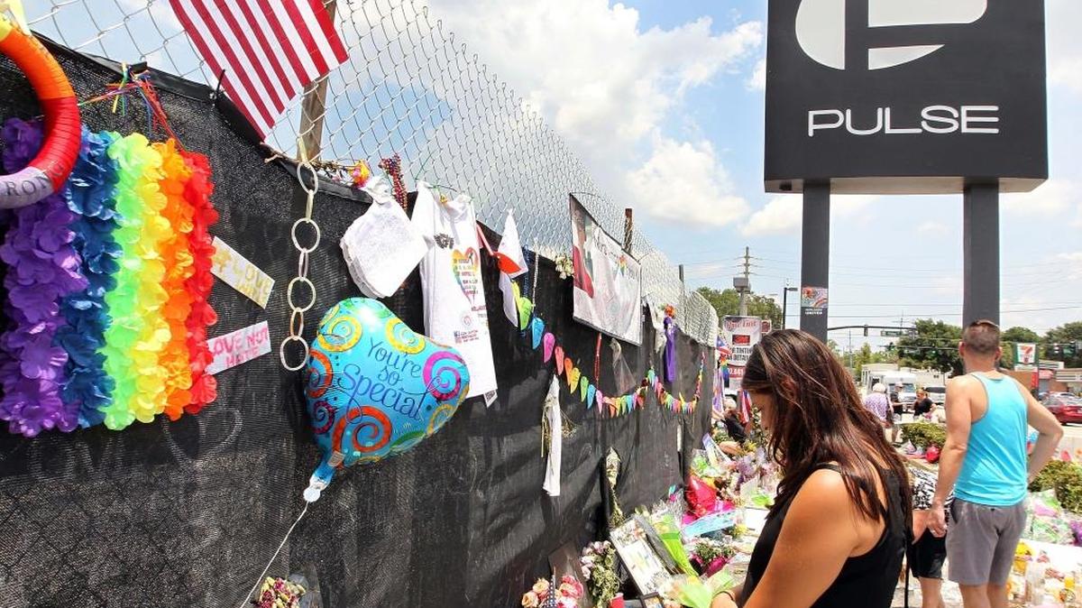 People expresses their respect to the victims of the Pulse Nightclub shooting by leaving flowers, photos, messages, candles, etc, in front of the building in Orlando, Florida as the Orlando community continues to mourn the victims of the deadly mass shooting at a gay nightclub on June 12. On June 28, 2016.