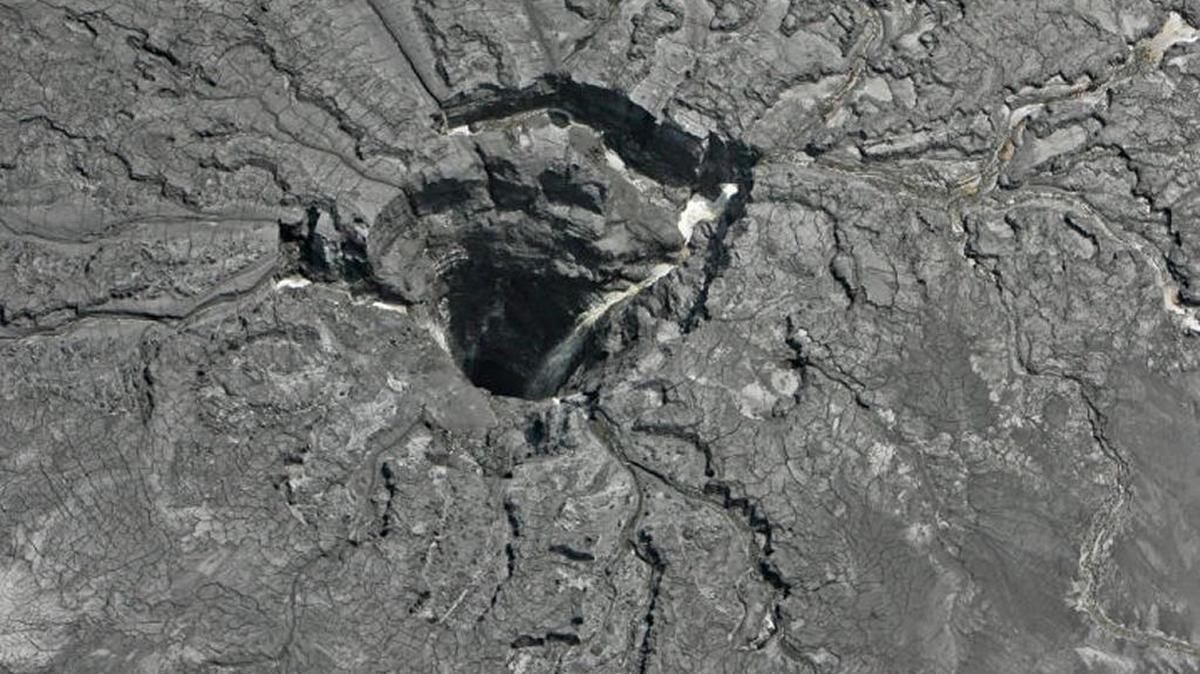 An aerial photo shows the sinkhole that opened up underneath a gypsum stack at the Mosaic plant in Mulberry.