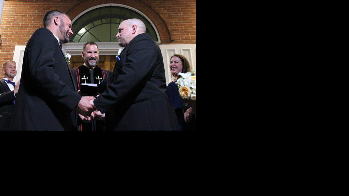 
Key West couple Aaron Huntsman and William Lee Jones are married on the Monroe County Courthouse steps shortly after midnight Tuesday, Jan. 6, 2015. Metropolitan Community Church Rev. Steve Torrence presided over the courthouse wedding. 
