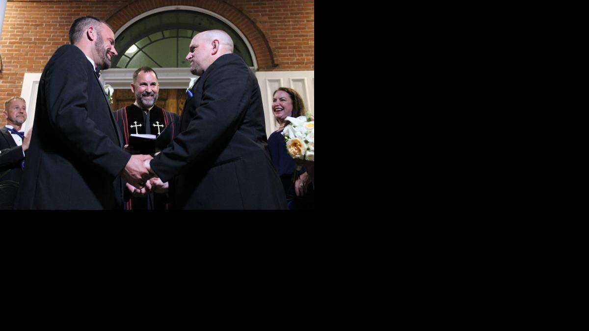 
Key West couple Aaron Huntsman and William Lee Jones are married on the Monroe County Courthouse steps shortly after midnight Tuesday, Jan. 6, 2015. Metropolitan Community Church Rev. Steve Torrence presided over the courthouse wedding. 
