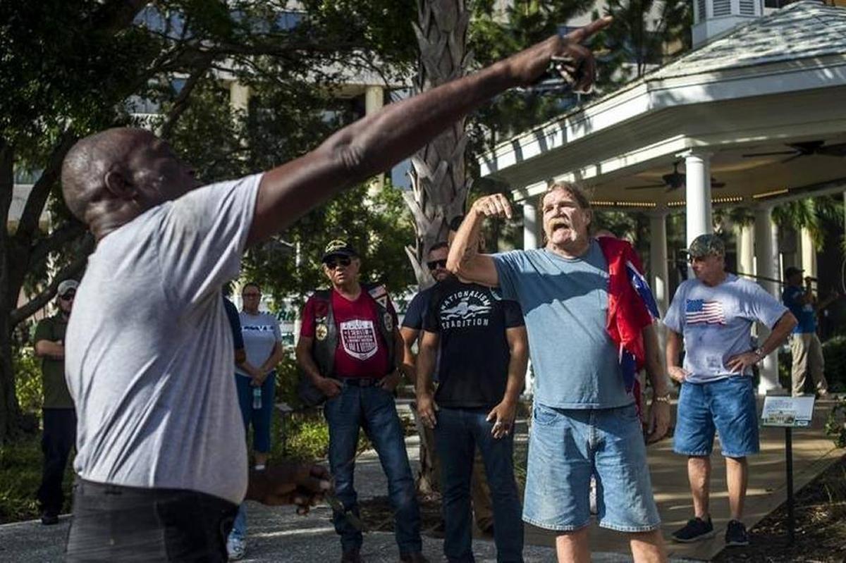Pro-monument protesters argue for the protection of the Confederate monument in front of the Manatee County Historic Courthouse on Monday evening in downtown Bradenton.