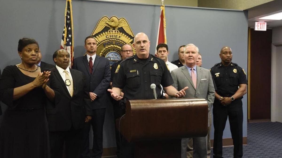 In a Nov. 28, 2017 photo, while Tampa Mayor Bob Buckhorn and Police Chief Brian Dugan announce that police had caught the man they believe responsible for the four slayings in Seminole Heights, the woman at the left, identified by police as Derlyn Roberts, was interpreting in American sign language that was largely indecipherable.