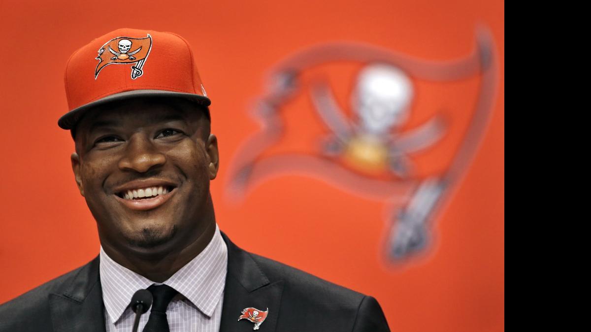 
Former Florida State quarterback Jameis Winston, selected as the No.1 overall pick in the NFL draft by the Tampa Bay Buccaneers, smiles during a news conference on Friday, May 1, 2015, in Tampa. Winston is firing back at his accuser, claiming he’s the real victim.
