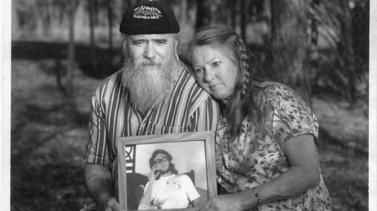 Anthony Barsotti, Jr. and Luann Barsotti hold a picture of their son, Anthony Barsotti III, who died from head trauma while a resident of North Florida Evaluation and Treatment Center after an employee pushed him into a concrete wall. "Only God knows what really happened that night. My son was brutally murdered, I felt, and nothing is going to change that," Anthony Barsotti, Jr. said. JOHN PENDYGRAFT | TIMES