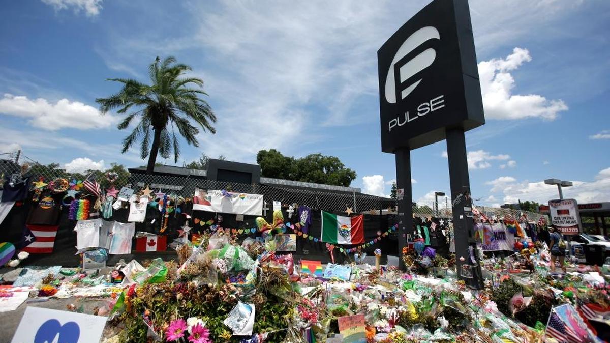 This photo taken July 11, 2016, shows a makeshift memorial continuing to grow outside the Pulse nightclub, the day before the one month anniversary of a mass shooting, in Orlando.