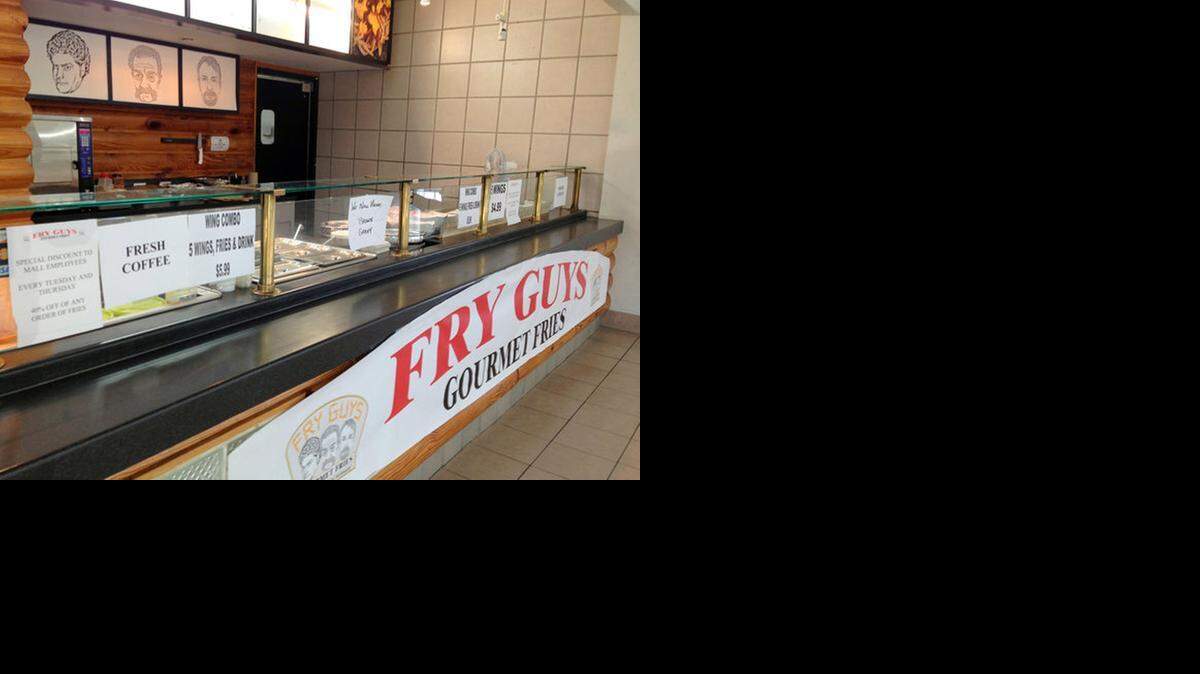 
Fry Guys Gourmet Fries has opened inside the DeSoto Square mall in Bradenton. One of its co-owners is the Rev. Terry Jones, shown in the company's logo in the middle. Jones is known for running what's considered a hate group for burning copies of the Quran. Jones agreed to take his picture down but have his face remain on the logo


