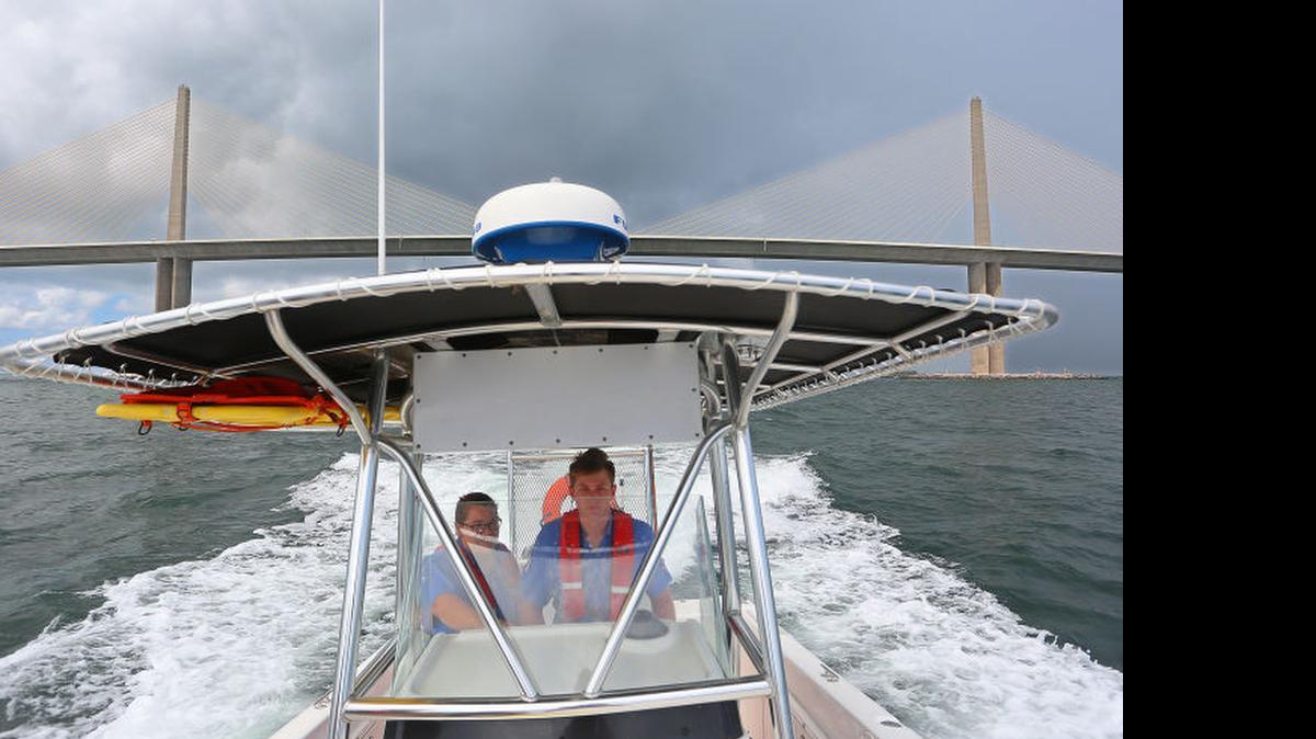 
Eckerd Search and Rescue team members Chelsea Duca, 20, and Matt Van Der Maelen, 22, make a run near the Skyway. 
