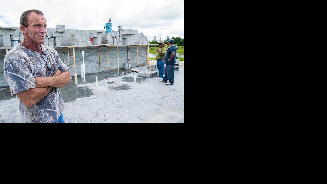 
Joseph Barrs surveys a project site near Naples in August. Barrs, victim of an elaborate workers’ compensation fraud scheme, says he recently found out that he needs a heart transplant.
