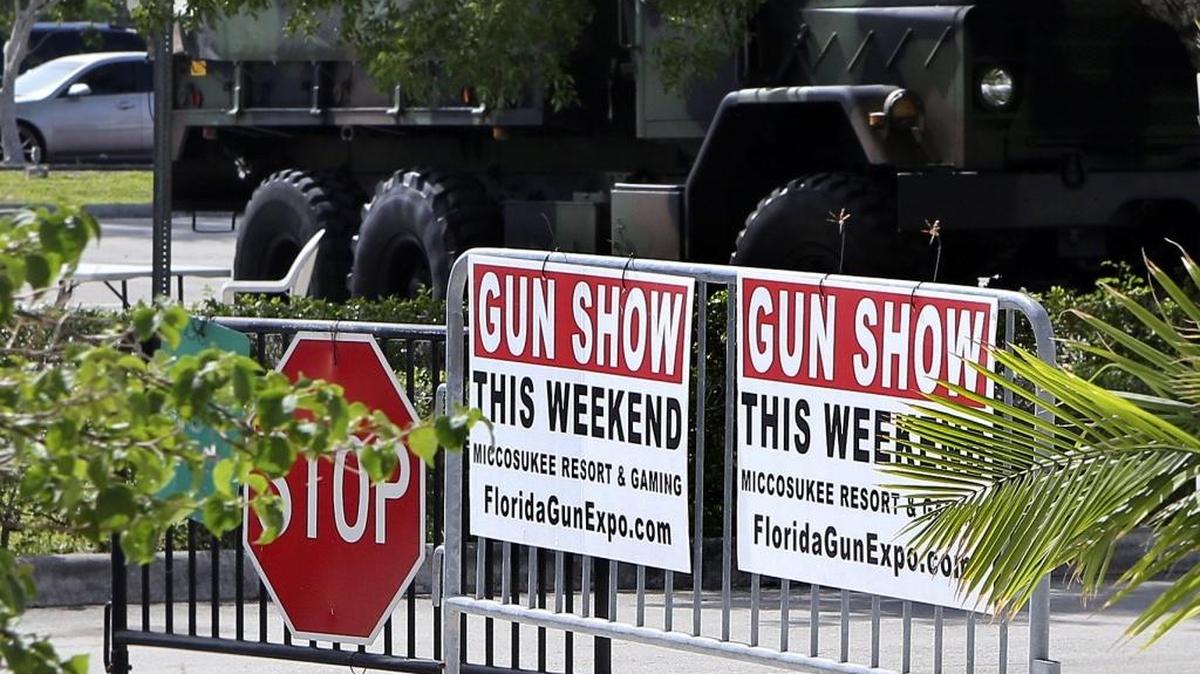 Signs for a weekend gun show are posted Saturday, June 18, 2016, outside Miccosukee Resort & Gaming, 500 SW 177th Ave., Miami. The gun show drew buyers and browsers nearly one week after Florida resident Omar Mateen used a semi-automatic rifle to kill 49 people and wound scores of others inside an Orlando club.