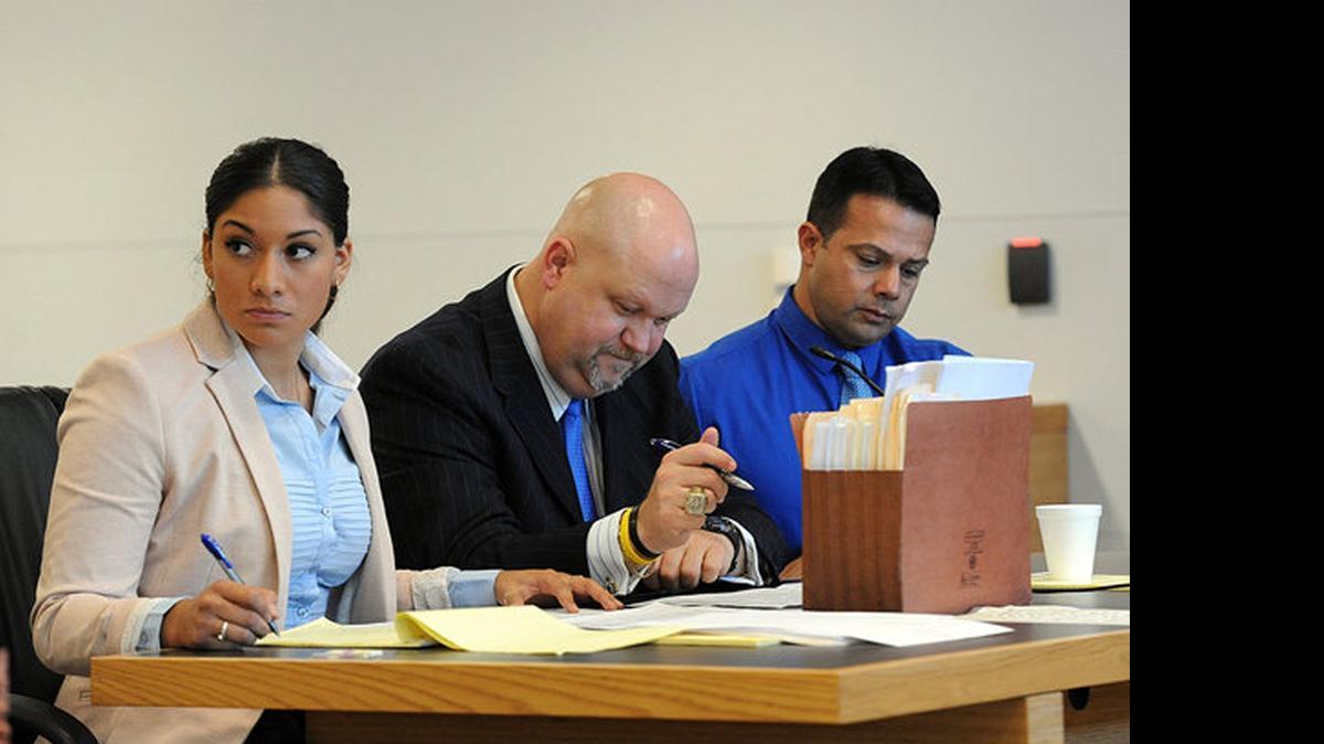 
Elissa Alvarez, 20, and Jose Caballero, 40, sit on either side of their attorney, Ronald Kurpiers, as they try to choose a jury for the trial for two counts of lewd and lascivious exhibition each after multiple witnesses reported to law enforcement that the two had been having sex on Cortez Beach at 8:36 p.m. on July 20, 2014.
