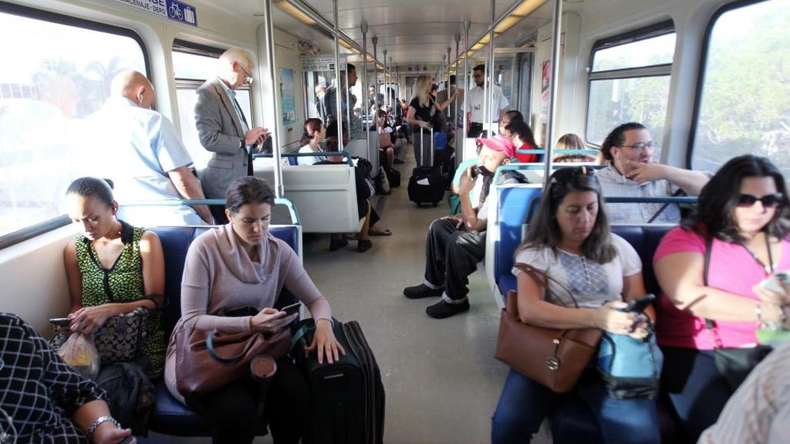 Passengers aboard Metrorail. A new express service is underway through Dec. 30.