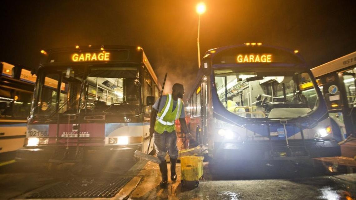 Terrell Samuels cleans buses at the Rosa Parks Central Bus Transportation Building on Wednesday, September 23, 2015.