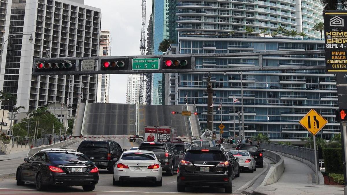 
Traffic is stopped as the Brickell Avenue drawbridge opens. Its frequent openings back up traffic for blocks. 
