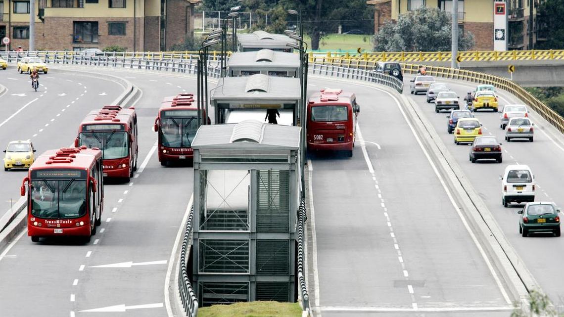 
TransMilenio buses circulating in the streets of Bogota, Colombia. Bogota has become one of the easiest cities in Latin America to get around, partly due to the installation of TransMilenio rapid transit buses. 
