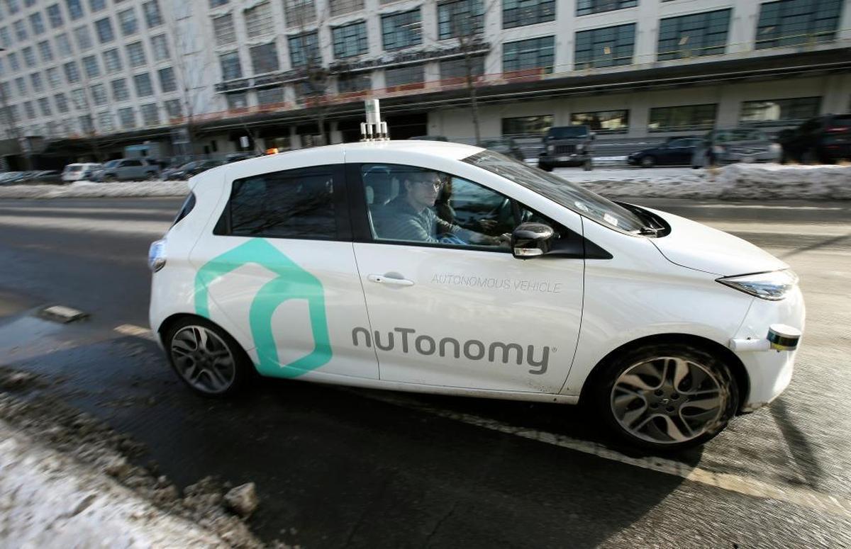 In this Tuesday, Jan. 10, 2017, file photo, an autonomous vehicle is driven by an engineer on a street in an industrial park in Boston.