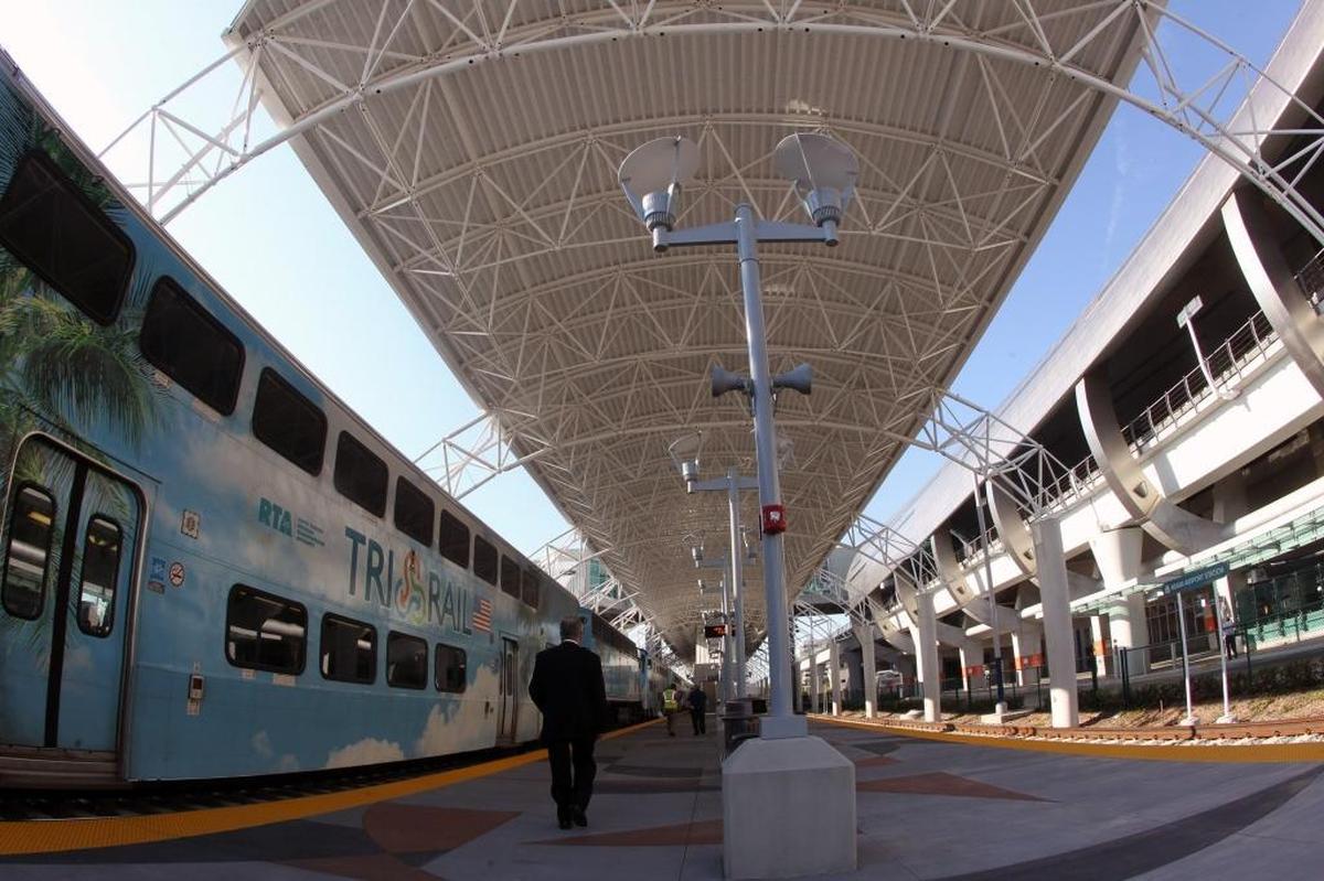 A Tri-rail train pulls into the station at the Miami Intermodal Center. The new Amtrak station was built with a platform too short for some of those trains.