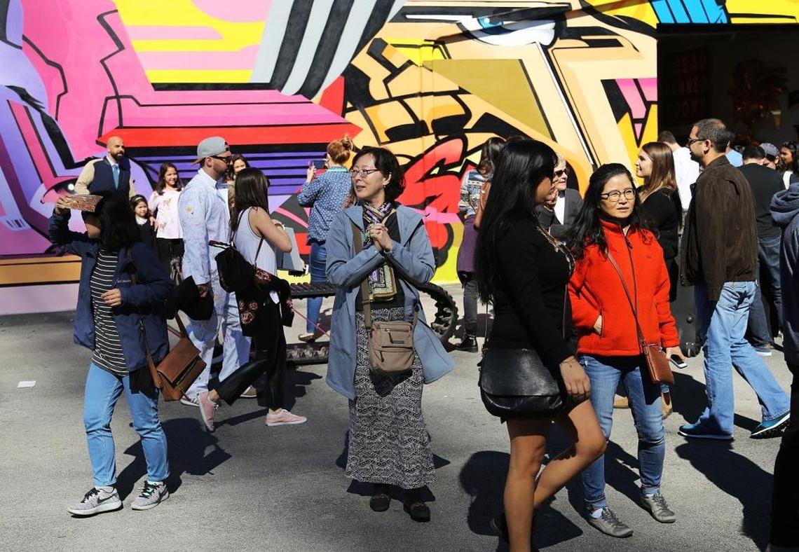 Tourists and locals gather in Wynwood for cool art under cool temperatures. Highs for the next few days are expected to be in the low 70s.