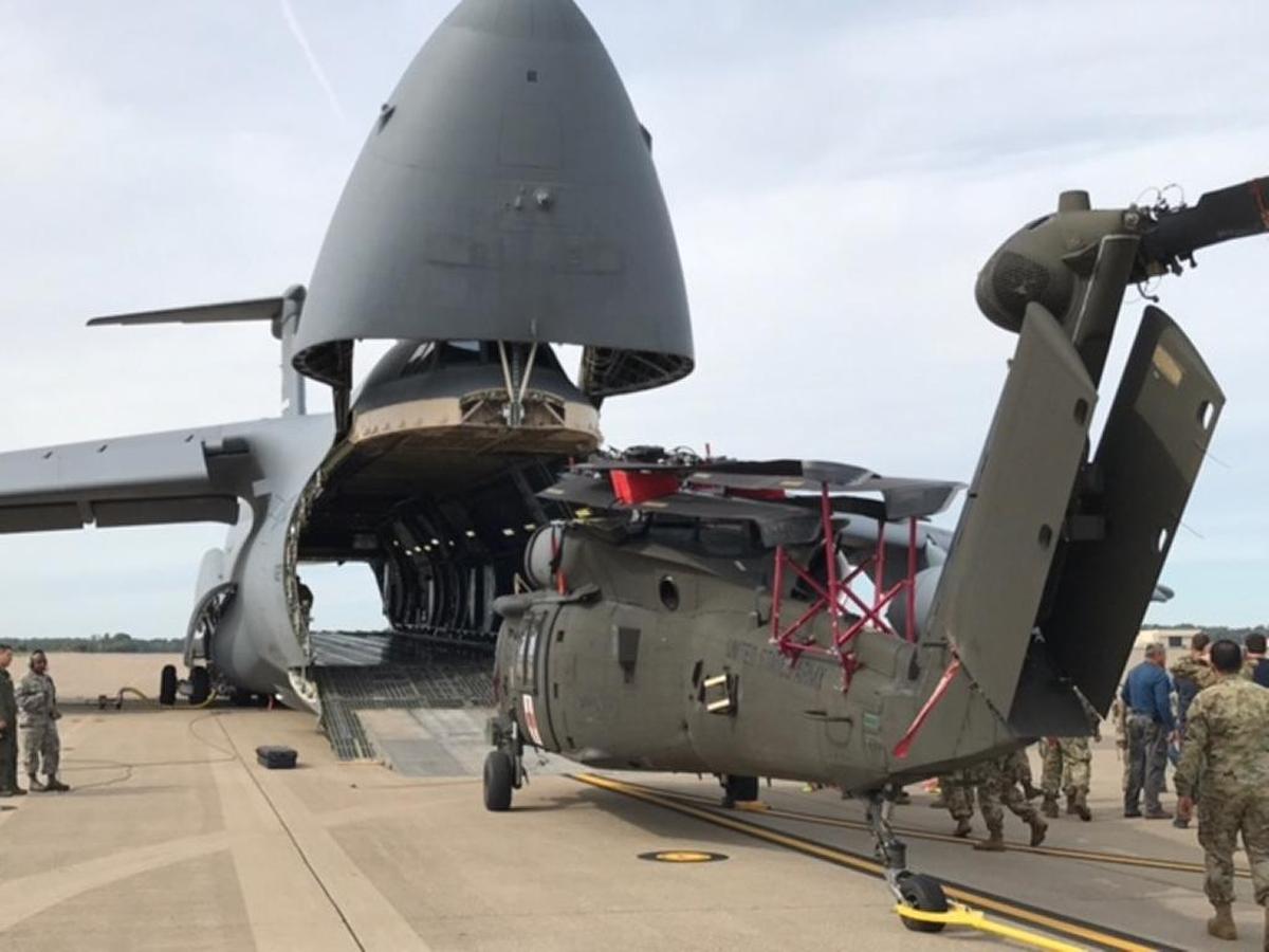 Soldiers with the 101st Combat Aviation Brigade, 101st Airborne Division (Air Assault) and Airmen assigned to the 68th Airlift Squadron, 433rd Airlift Wing prepare to load an HH-60 medevac Blackhawk helicopter into a C-5M Super Galaxy, on Sept. 11, 2017. The helicopter is one of 35 aircraft that the 101st was relocating to Alabama to be available to Florida to support Irma relief efforts.