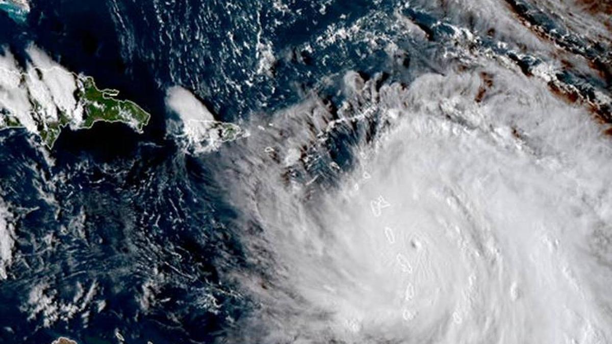This Monday, Sept. 18, 2017, GOES East satellite image provided by NASA shows the eye of Hurricane Maria as it nears the island of Dominica. Maria has strengthened into a Category 5 hurricane.