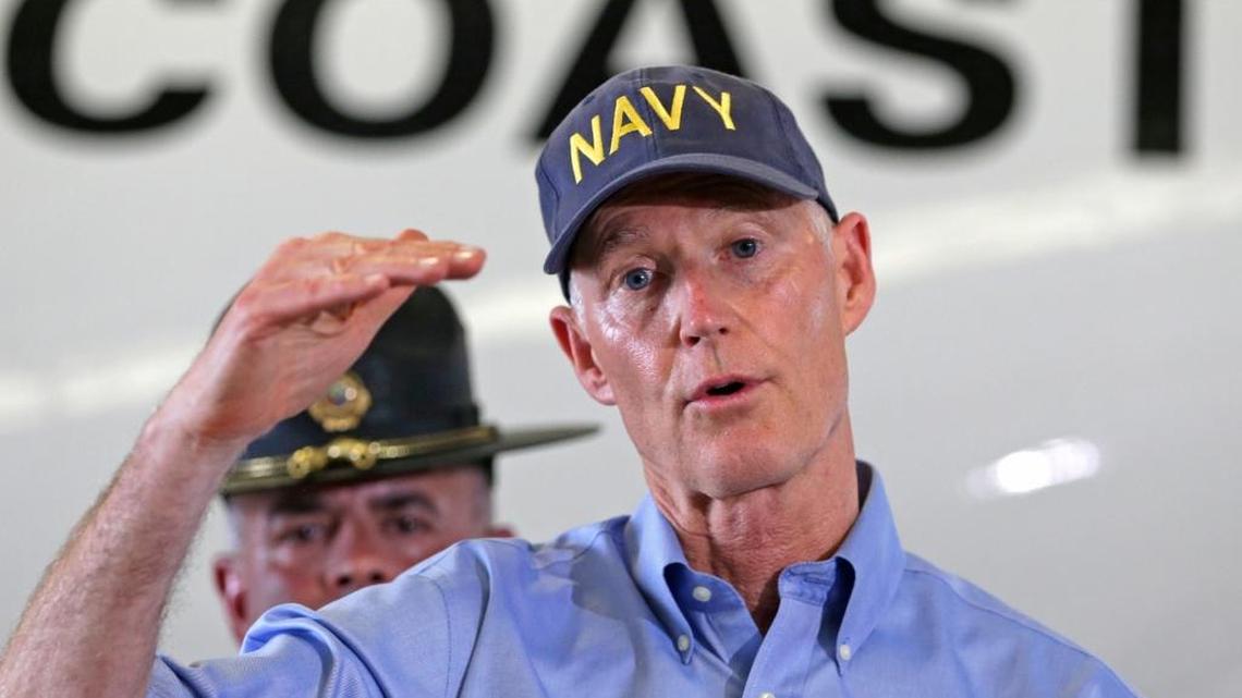Gov. Rick Scott talks to reporters during a news conference, at the U.S. Coast Guard Air Station Miami, Monday, Sept. 11, 2017, in Opa-locka. Scott flew over the Florida Keys to assess damage from Hurricane Irma.