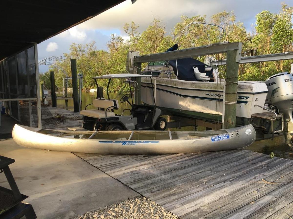 The flooding and winds of Hurricane Irma managed to drag a golf cart and canoe onto Joe West’s back porch in Everglades City. West said he had no idea where the items had originally been located.