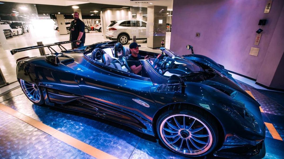 Brett David, the CEO of Prestige Imports, drives a $15 million Pagani Zonda into the car elevator at the Porsche Design Tower in Sunny Isles Beach.