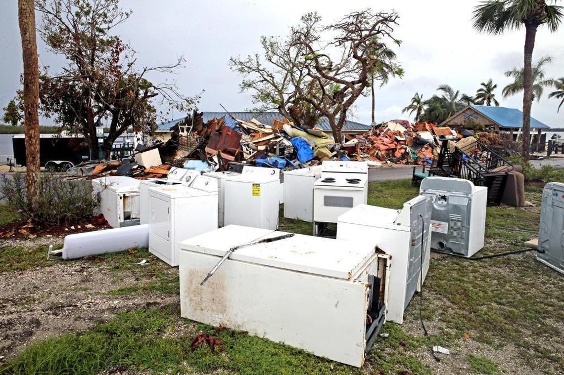 Appliances damaged by the surge from Hurricane Irma at the Chokoloskee Island Park and Marina await removal, along with mounds of debris found on every street on the island.