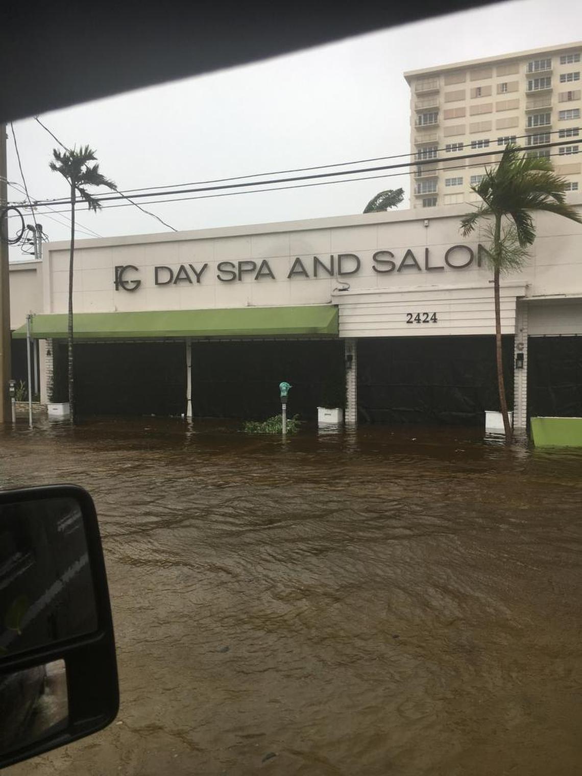 The road in front of a day spa on East Las Olas Boulevard in Fort Lauderdale flooded Sunday.
