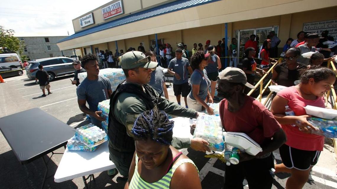 Residents wait in line for food and water at a Goodwill location in the wake of Hurricane Irma on September 13, 2017, in Belle Glade.