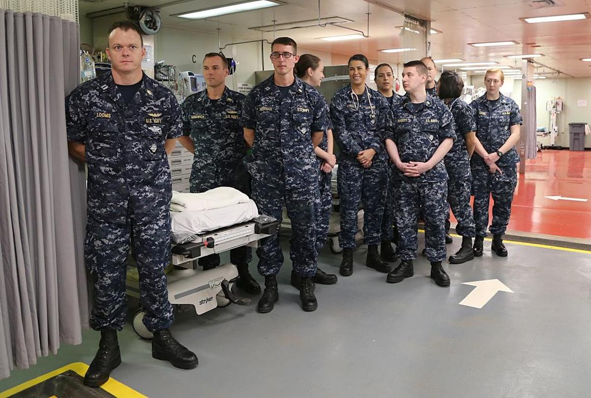 Medical crew members aboard the hospital ship USNS Comfort arrive in Puerto Rico, which arrived in Puerto Rico to assist in humanitarian relief efforts.