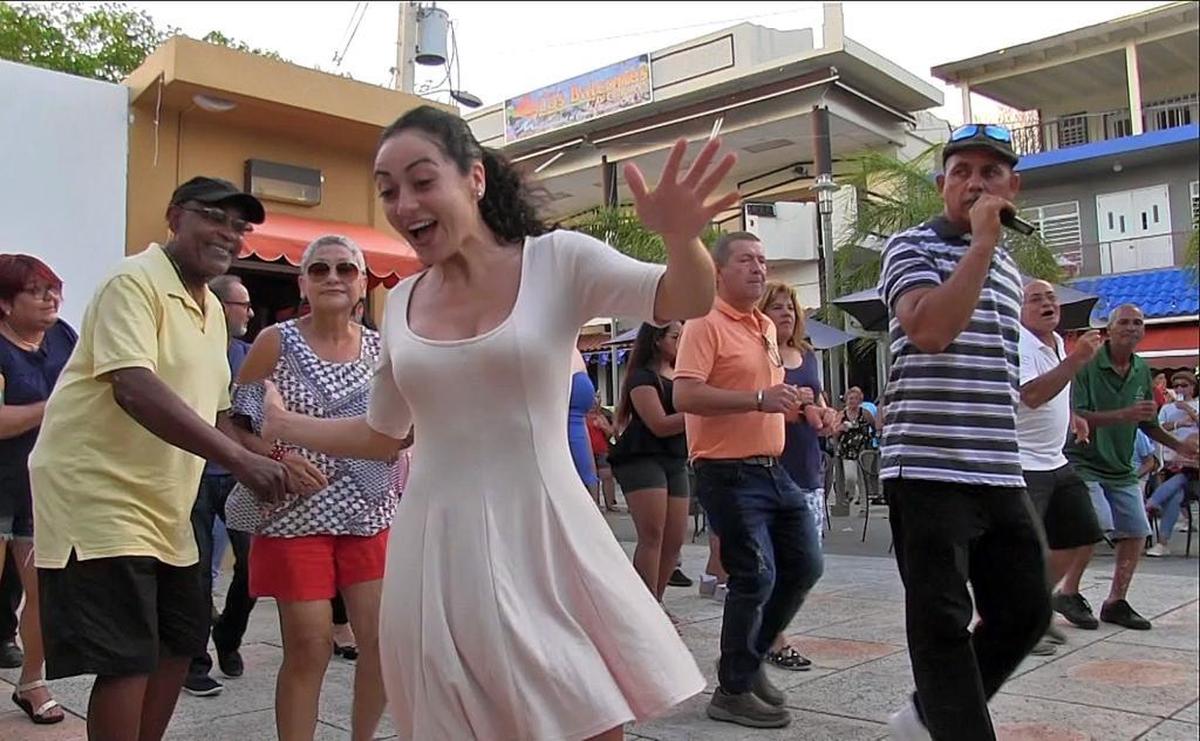 Salsa and dancing lessons were part of the appeal in the town square of Lajas in La Parguera in Puerto Rico. Many residents from San Juan have visited as break from tough conditions at home but business in the resort town is still down.