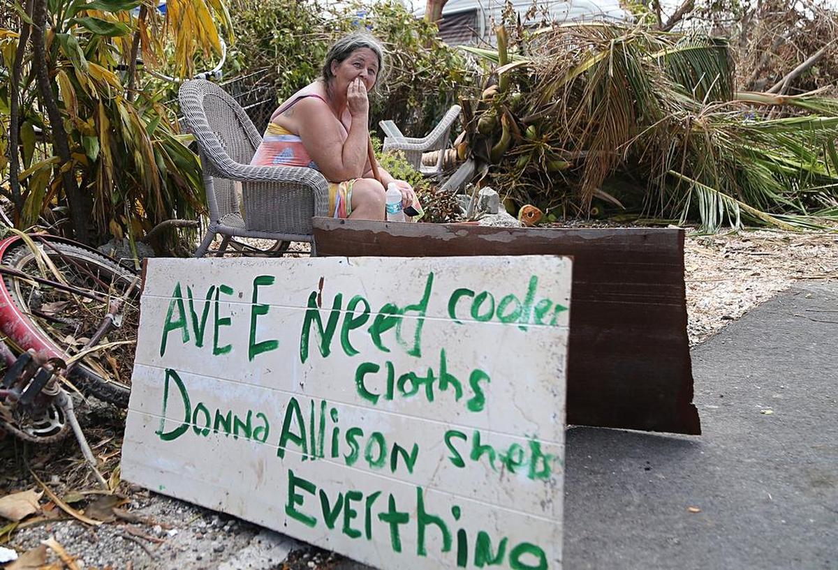 Donna Allison, 58, sits in front of her house in Big Pine Key on Saturday, Sept. 16, 2017. Allison decided not to evacuate and instead spent the night in her home with her two dogs as Hurricane Irma made its way through South Florida.