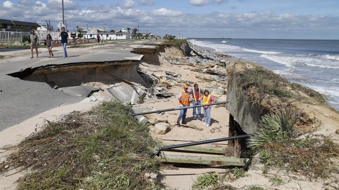Florida Department of Transportation workers inspect A1A in Flagler Beach after Hurricane Matthew caused heavy beach erosion.